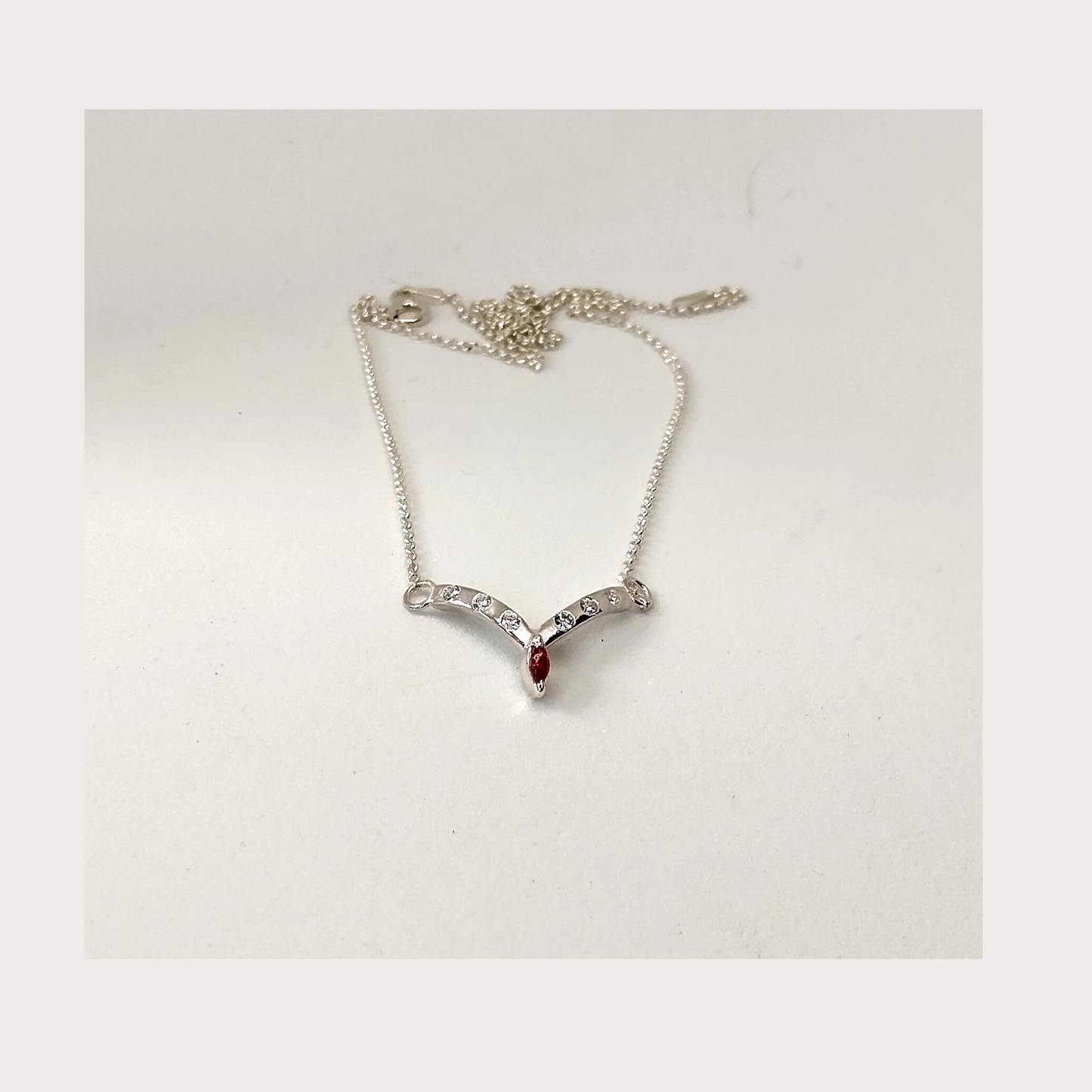 Garnet and cubic zirconia, wishbone necklace Sterling silver