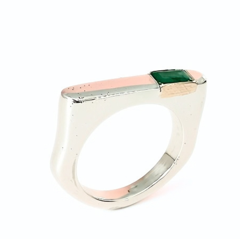 A modern silver ring featuring a rectangular top with a central green square gemstone, flanked by a rose gold inlay and a polished silver edge, set against a plain white background.