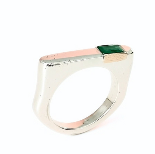 A modern silver ring featuring a rectangular top with a central green square gemstone, flanked by a rose gold inlay and a polished silver edge, set against a plain white background.