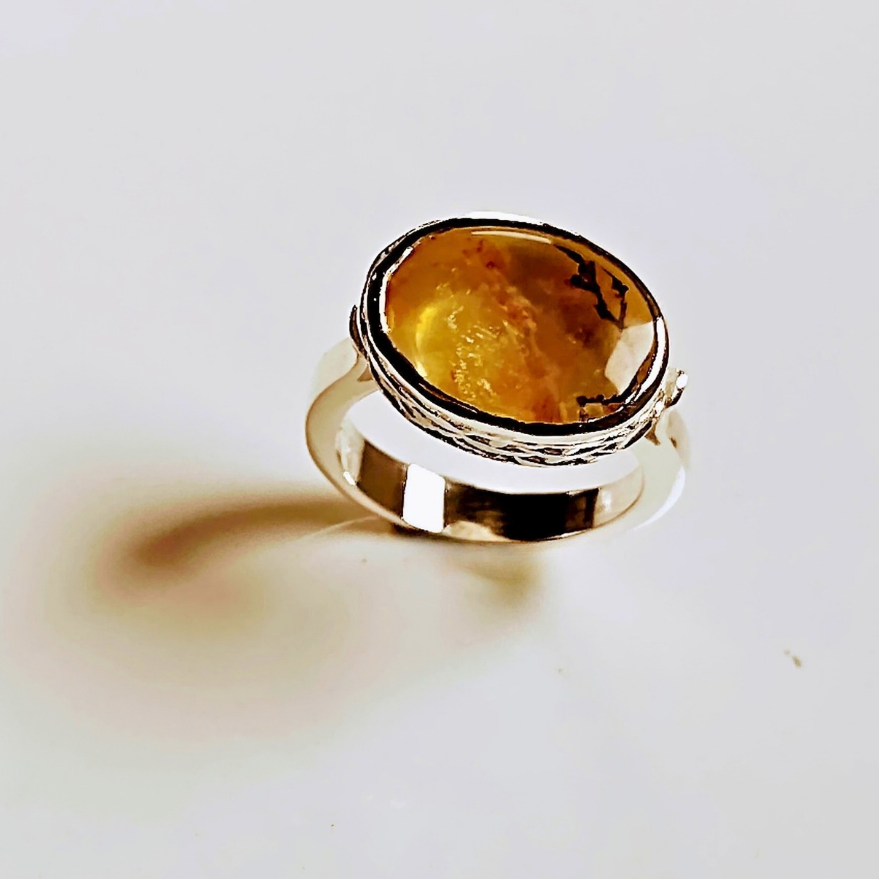 Golden dendritic quartz ring handmade in sterling silver with textured setting.